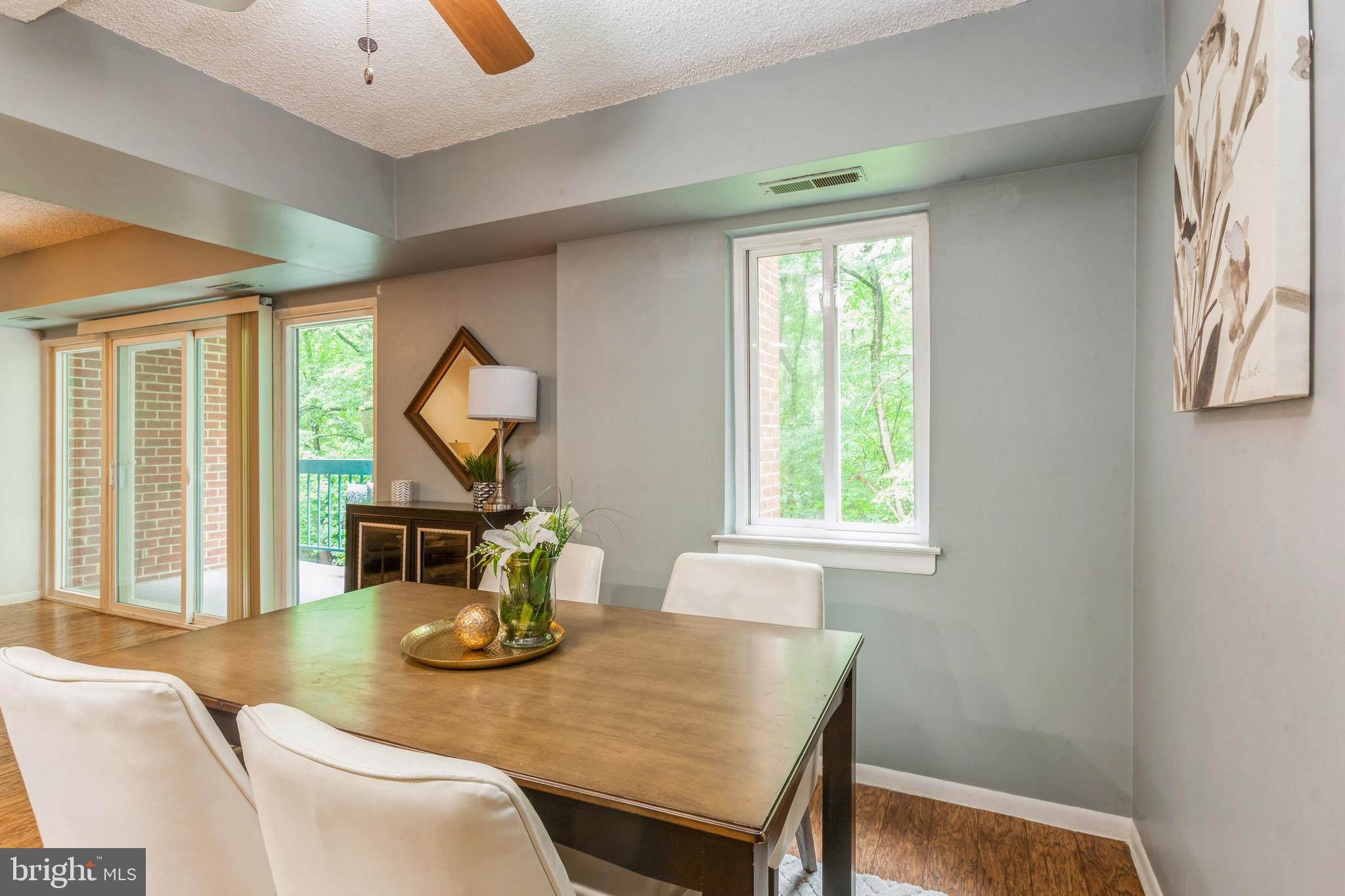 11833 Shire Court, Unit 12C Reston, VA 20191 - Photo 10 of 28 a view of a dining room with furniture window and outside view