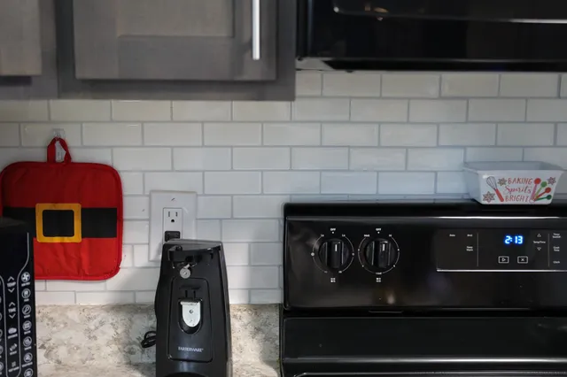 a living room with furniture fireplace and a window