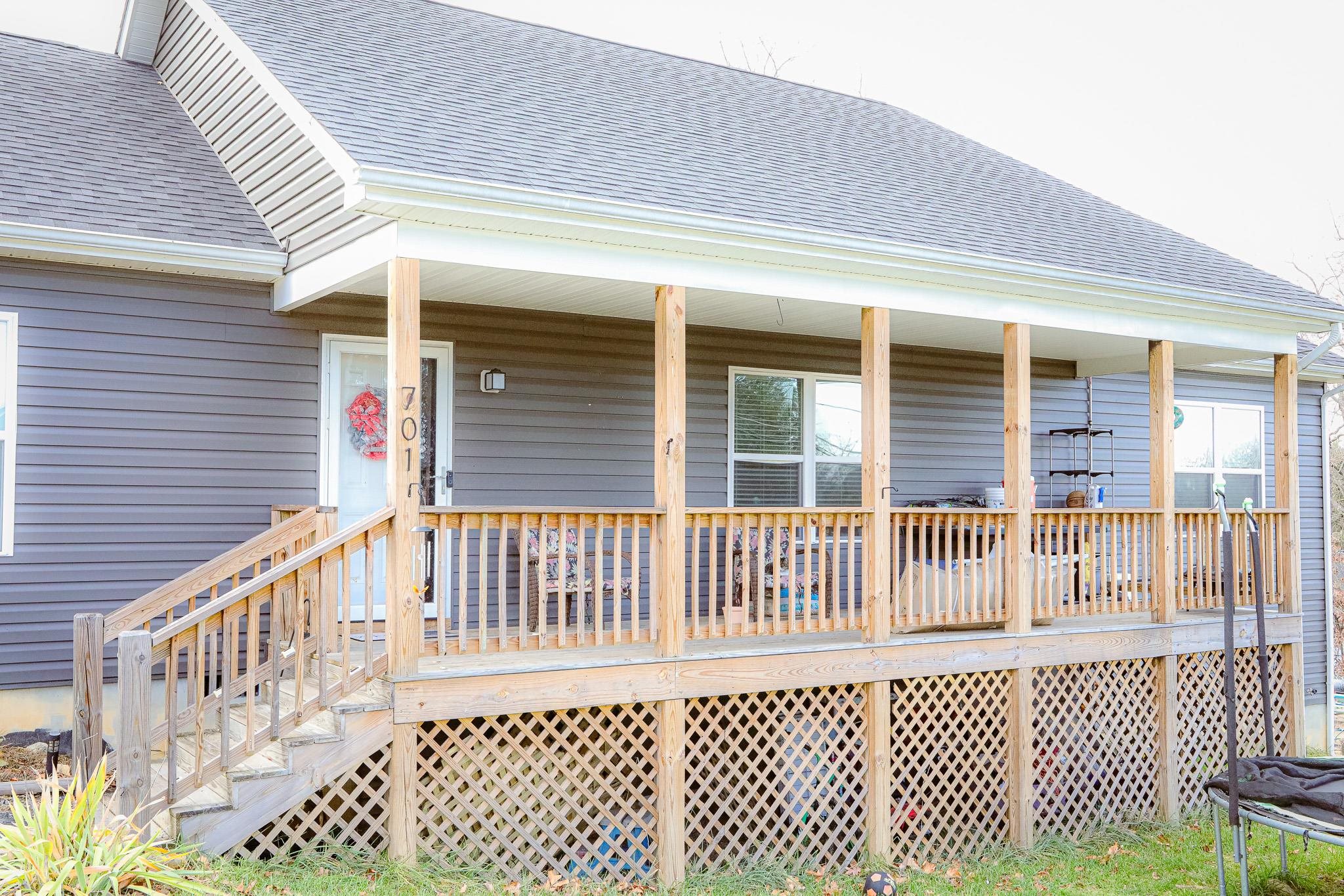 701 Western Road Waynesboro, VA 22980 - Photo 2 of 42 a view of a brick house with wooden fence