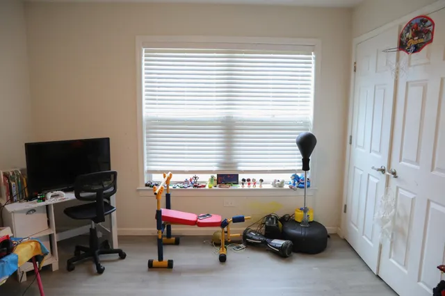 a bedroom with a bed and a couch