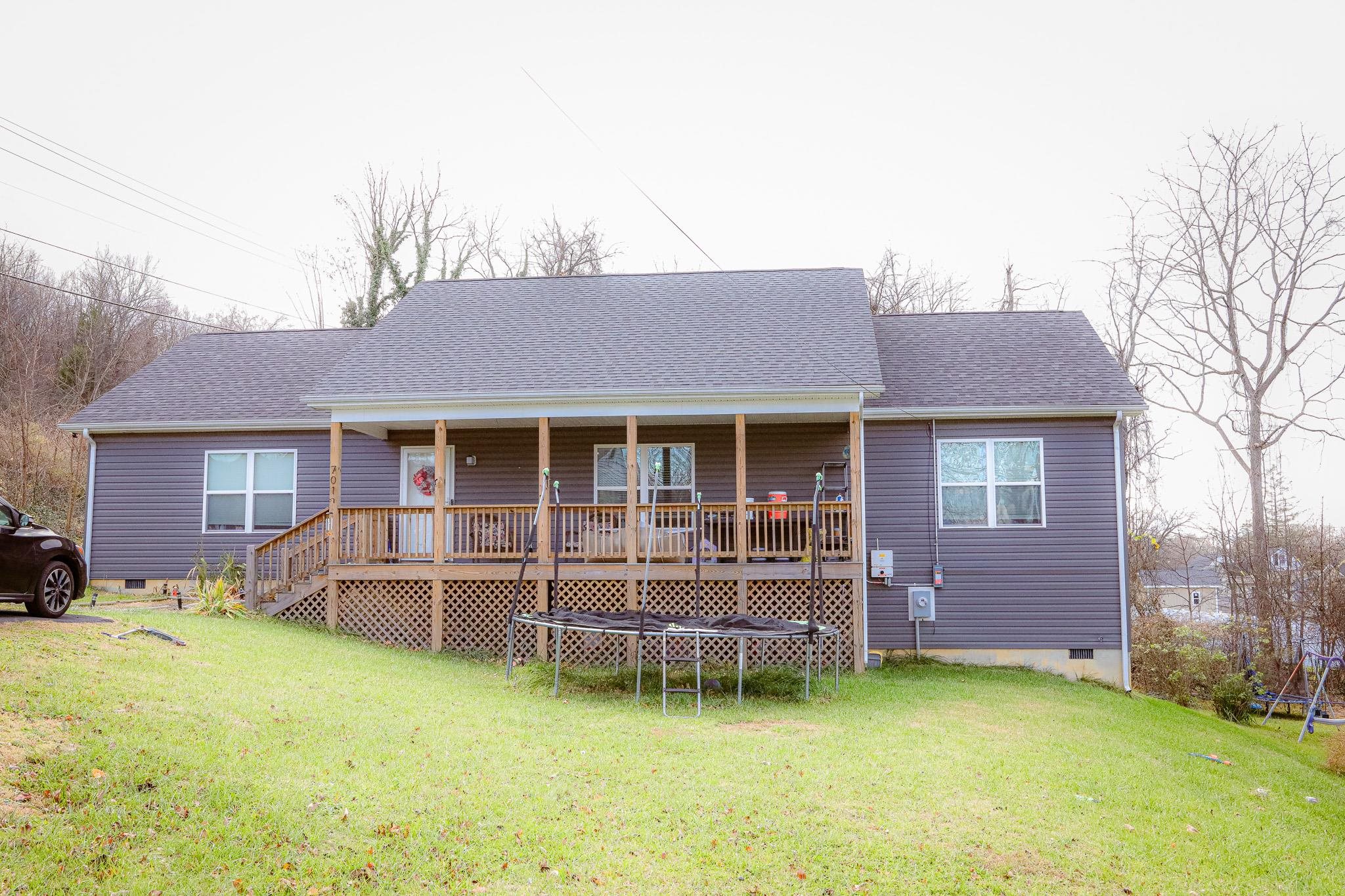 701 Western Road Waynesboro, VA 22980 - Photo 4 of 42 a view of a house with a patio and a yard