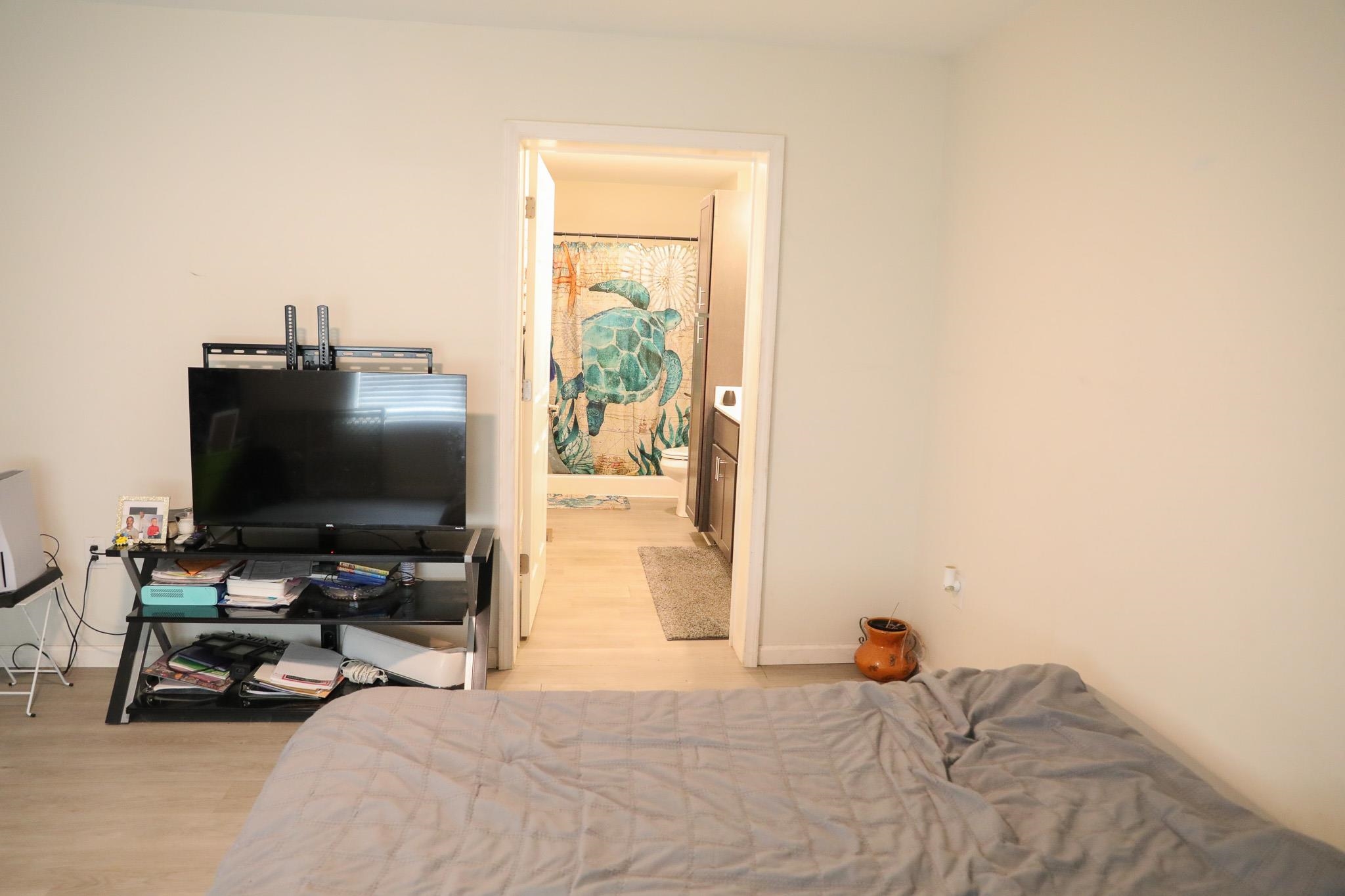 701 Western Road Waynesboro, VA 22980 - Photo 42 of 42 a bedroom with a bed and a flat screen tv