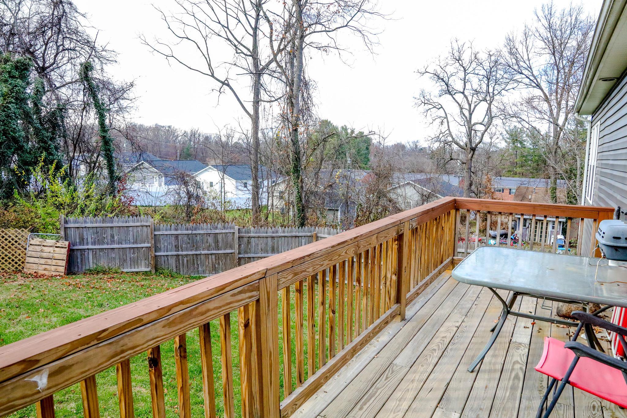 701 Western Road Waynesboro, VA 22980 - Photo 9 of 42 a view of a balcony with wooden floor and trees