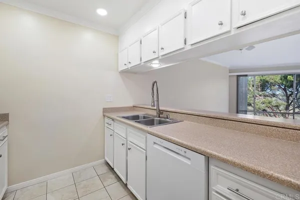 a kitchen with a sink and cabinets