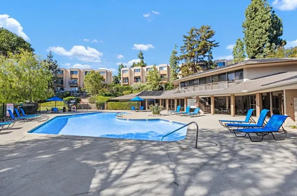 a view of a lake with houses in the background