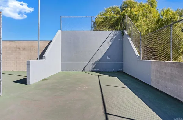 a swimming pool with outdoor seating and yard