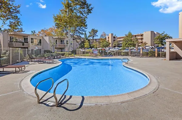 a view of a balcony with floor to ceiling windows