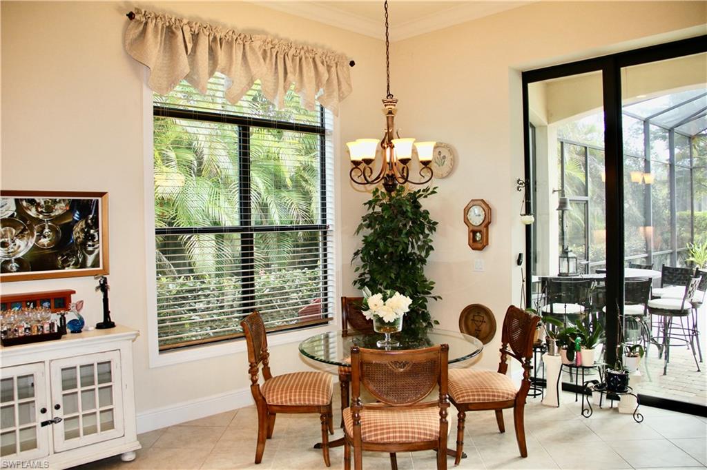 9321 Vercelli Court Naples, FL 34113 - Photo 16 of 49 a view of a dining room with furniture window and outside view