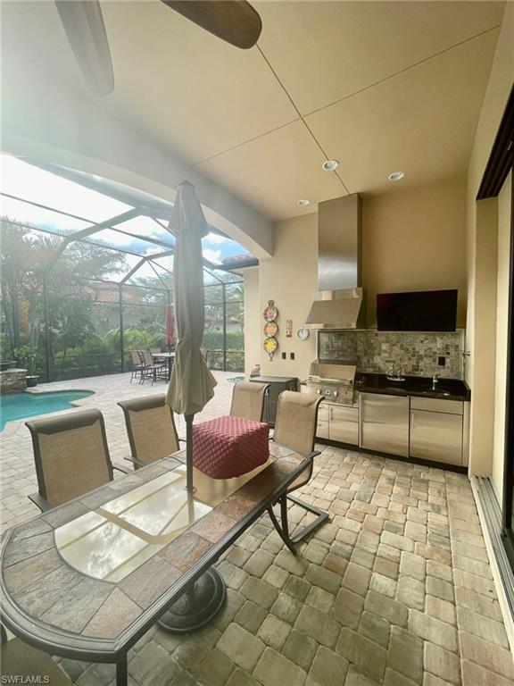 9321 Vercelli Court Naples, FL 34113 - Photo 26 of 49 a living room with furniture and a large window