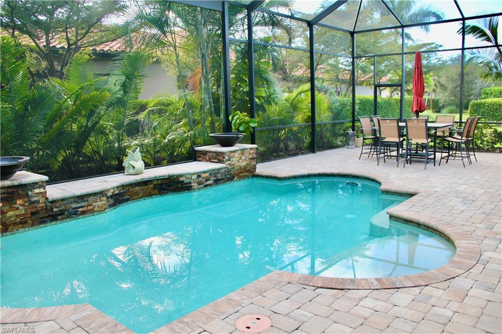 9321 Vercelli Court Naples, FL 34113 - Photo 27 of 49 a view of a swimming pool with a patio