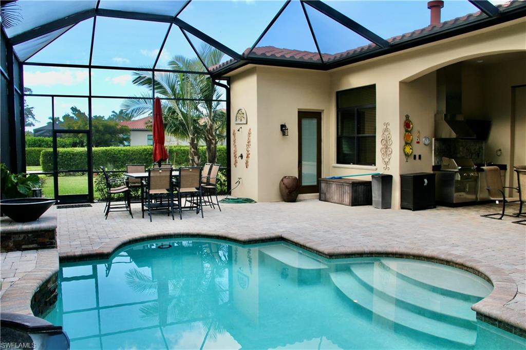 9321 Vercelli Court Naples, FL 34113 - Photo 30 of 49 a view of pool with outdoor seating