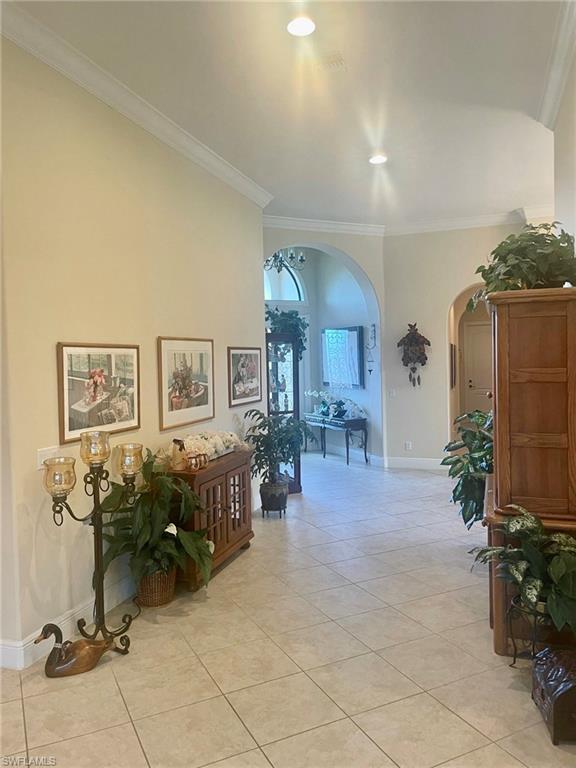 9321 Vercelli Court Naples, FL 34113 - Photo 3 of 49 a view of a livingroom with furniture and a potted plant
