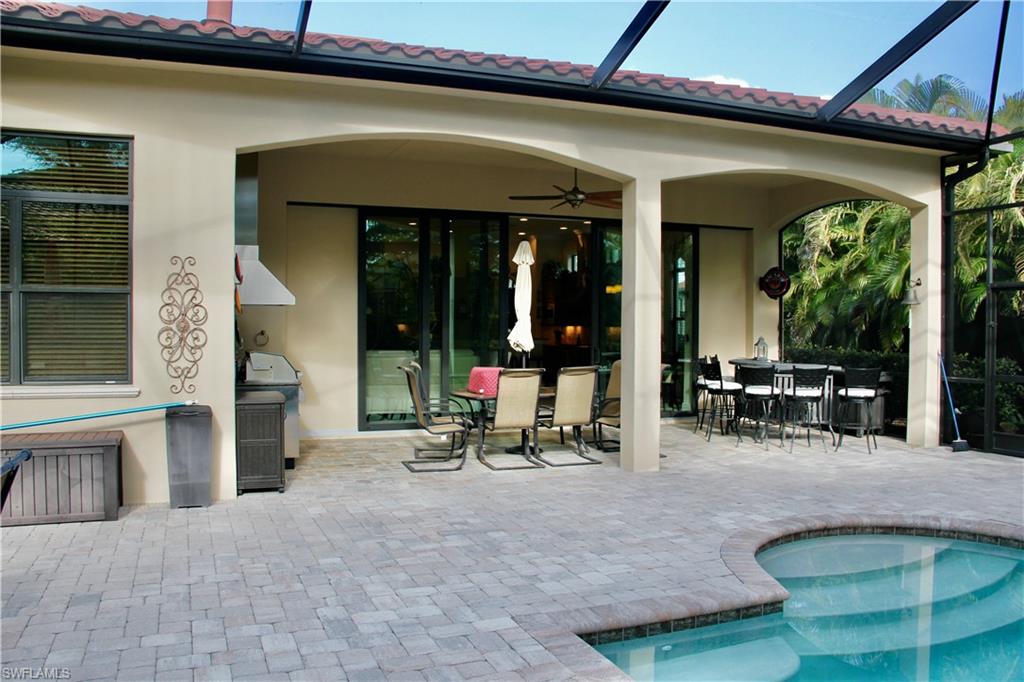9321 Vercelli Court Naples, FL 34113 - Photo 33 of 49 a view of a house with sitting area and porch