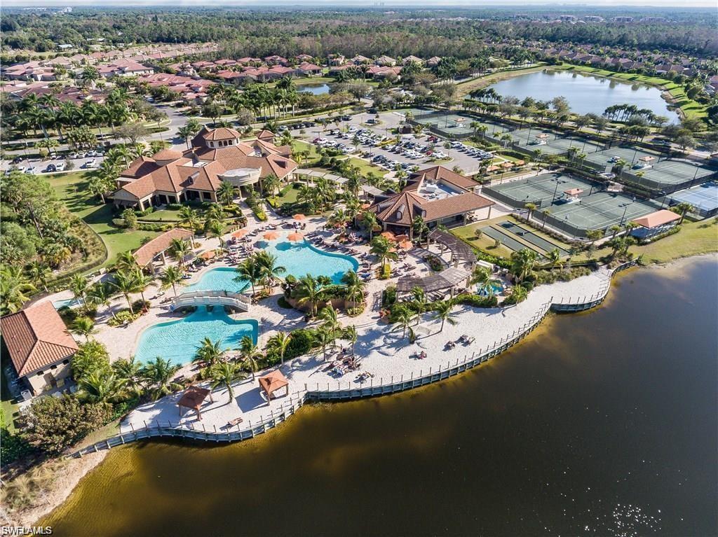 9321 Vercelli Court Naples, FL 34113 - Photo 48 of 49 an aerial view of residential houses with outdoor space and lake view