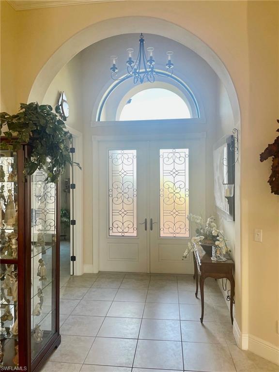9321 Vercelli Court Naples, FL 34113 - Photo 6 of 49 a lobby with furniture and a chandelier