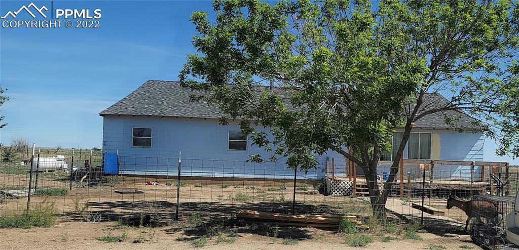 18761 County Road J Ordway, CO 81063 - Photo 2 of 26 a front view of a house with garden