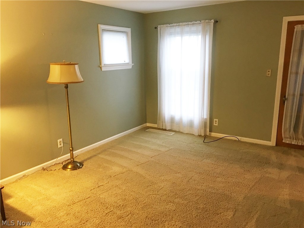 7919 Spring Garden Road Cleveland, OH 44129 - Photo 7 of 25 Neutral carpeting and paint throughout