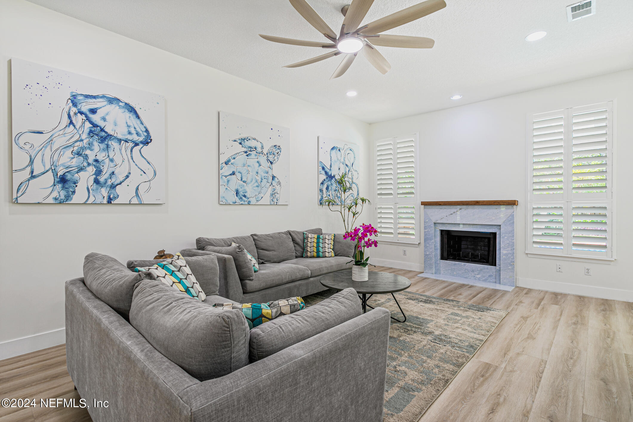 622 Cherry Street Neptune Beach, FL 32266 - Photo 12 of 77 a living room with furniture and a fireplace