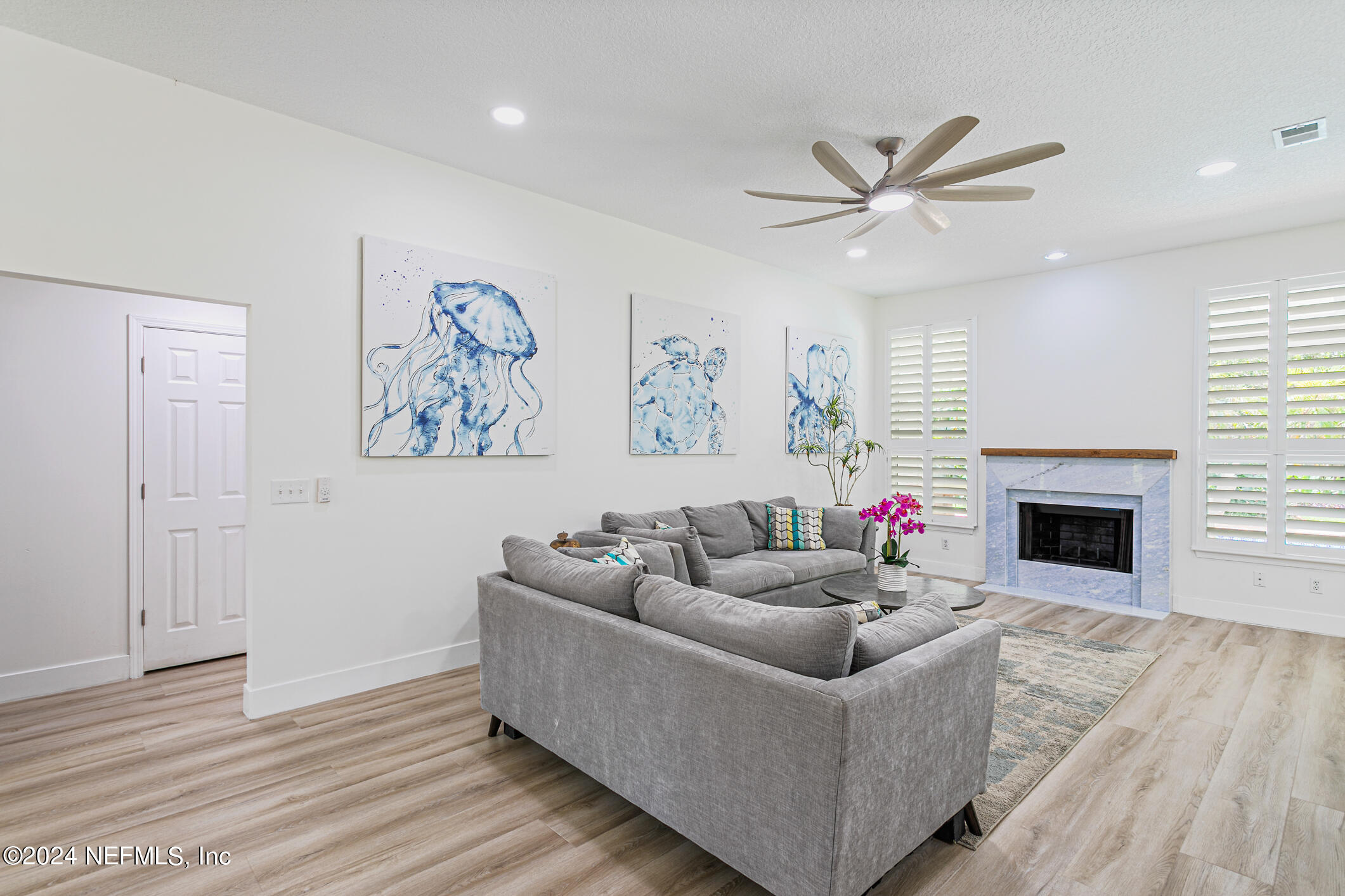 622 Cherry Street Neptune Beach, FL 32266 - Photo 13 of 77 a living room with furniture and a fireplace