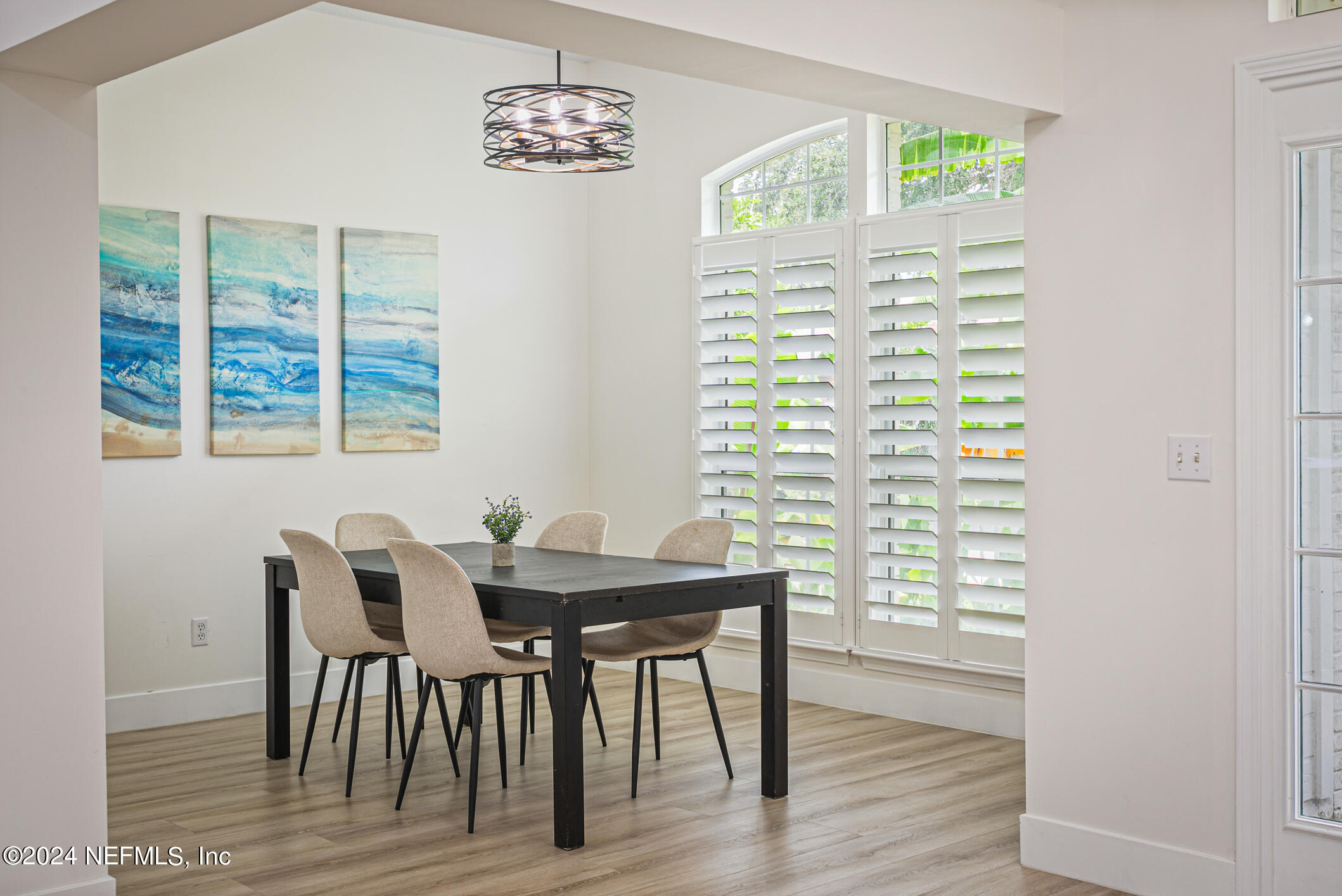 622 Cherry Street Neptune Beach, FL 32266 - Photo 19 of 77 a view of a dining room with furniture and wooden floor