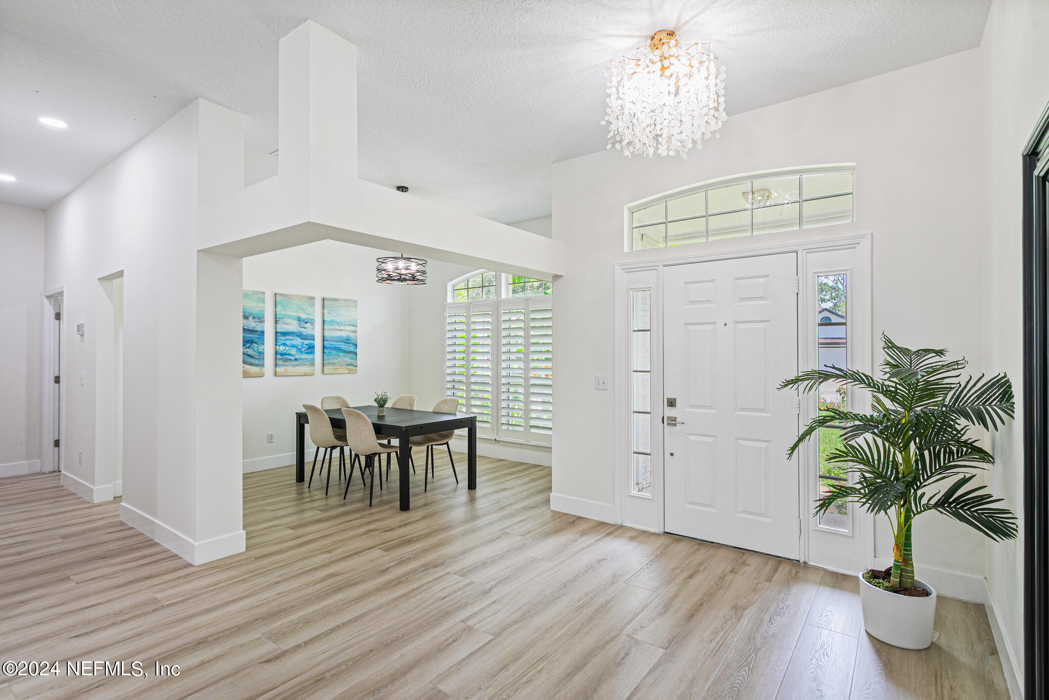 622 Cherry Street Neptune Beach, FL 32266 - Photo 20 of 77 a view of a dining room with furniture window and wooden floor