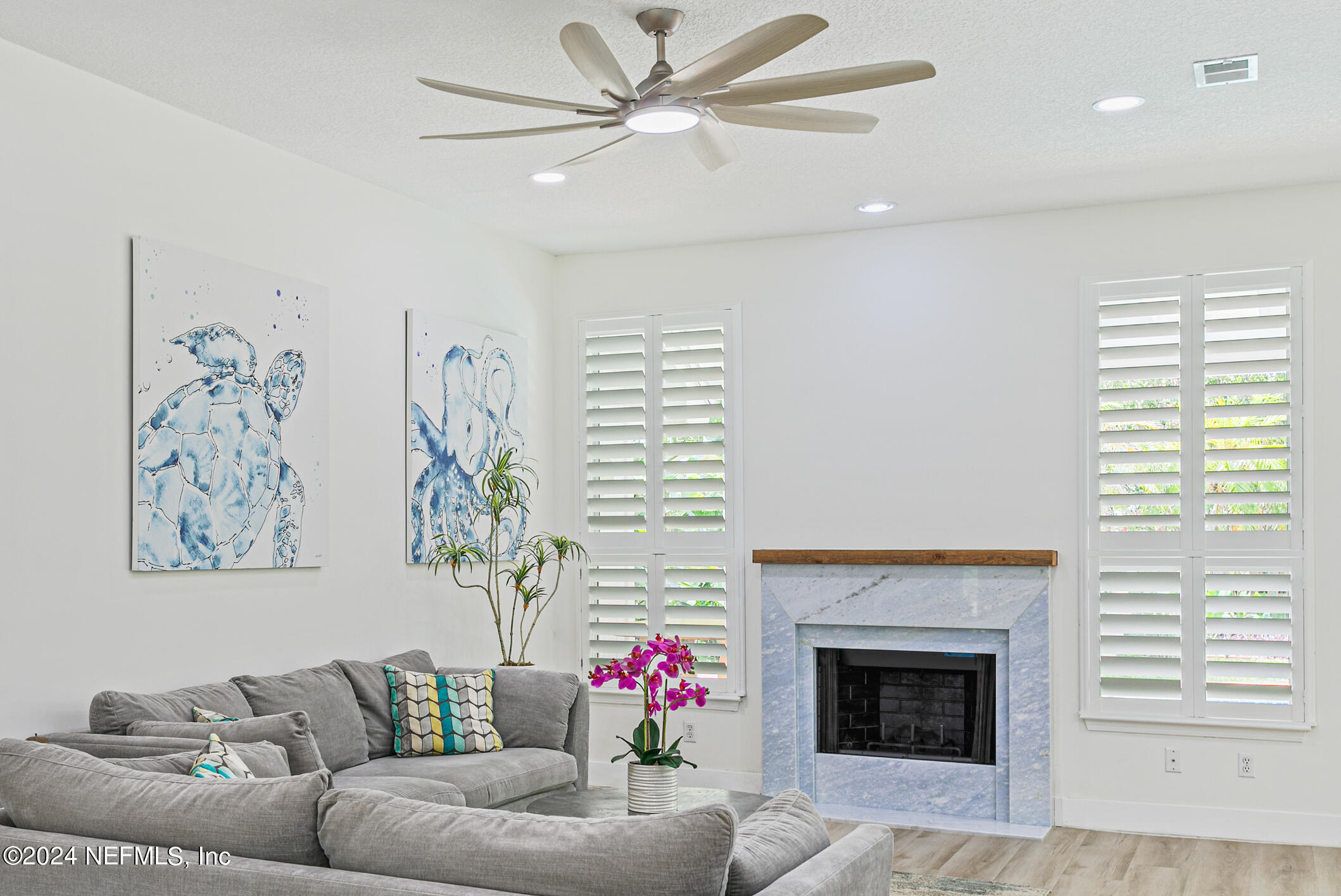 622 Cherry Street Neptune Beach, FL 32266 - Photo 21 of 77 a living room with furniture a fireplace and a window