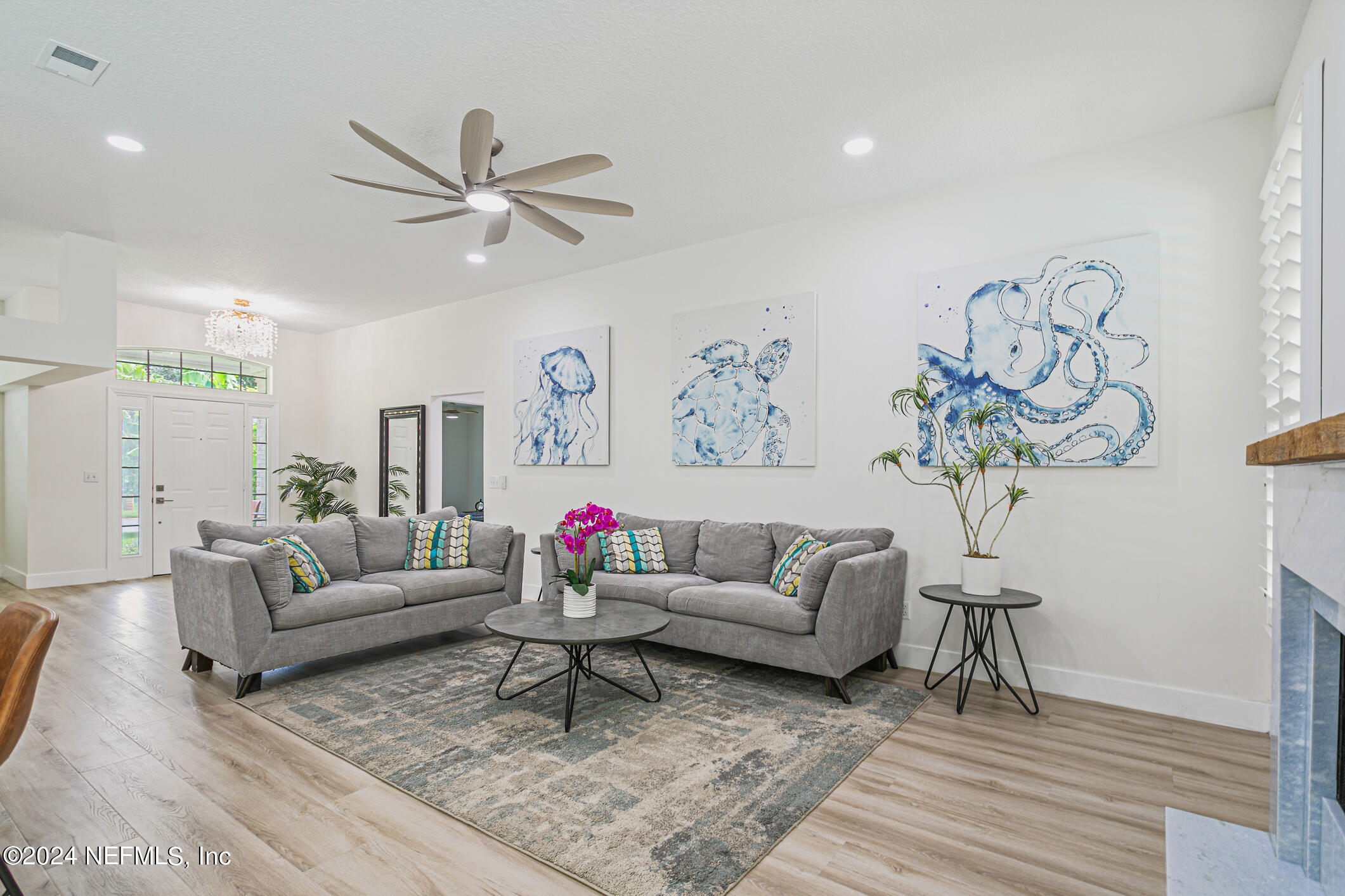 622 Cherry Street Neptune Beach, FL 32266 - Photo 22 of 77 a living room with furniture and a potted plant