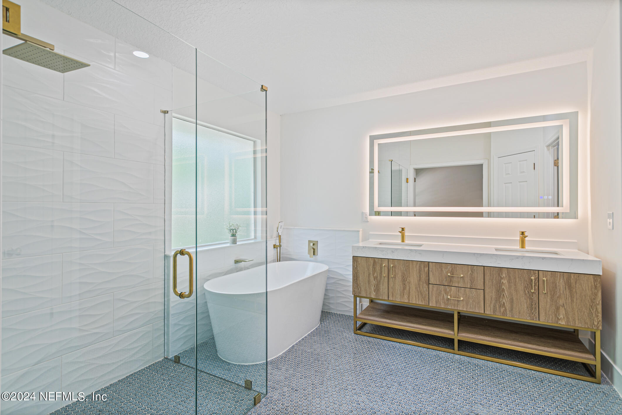 622 Cherry Street Neptune Beach, FL 32266 - Photo 24 of 77 a bathroom with a double vanity sink a mirror and a bathtub