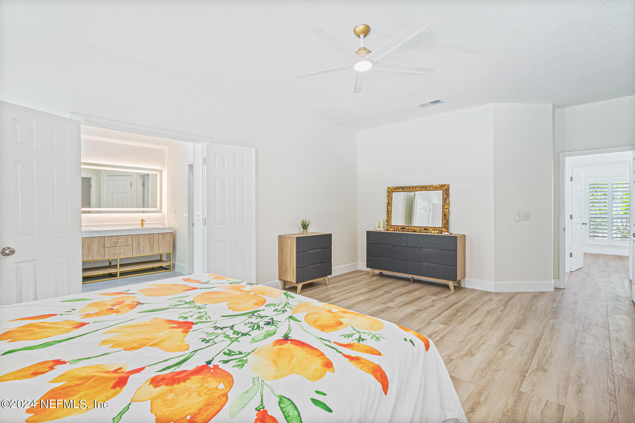 622 Cherry Street Neptune Beach, FL 32266 - Photo 29 of 77 a bedroom with a bed and a dresser