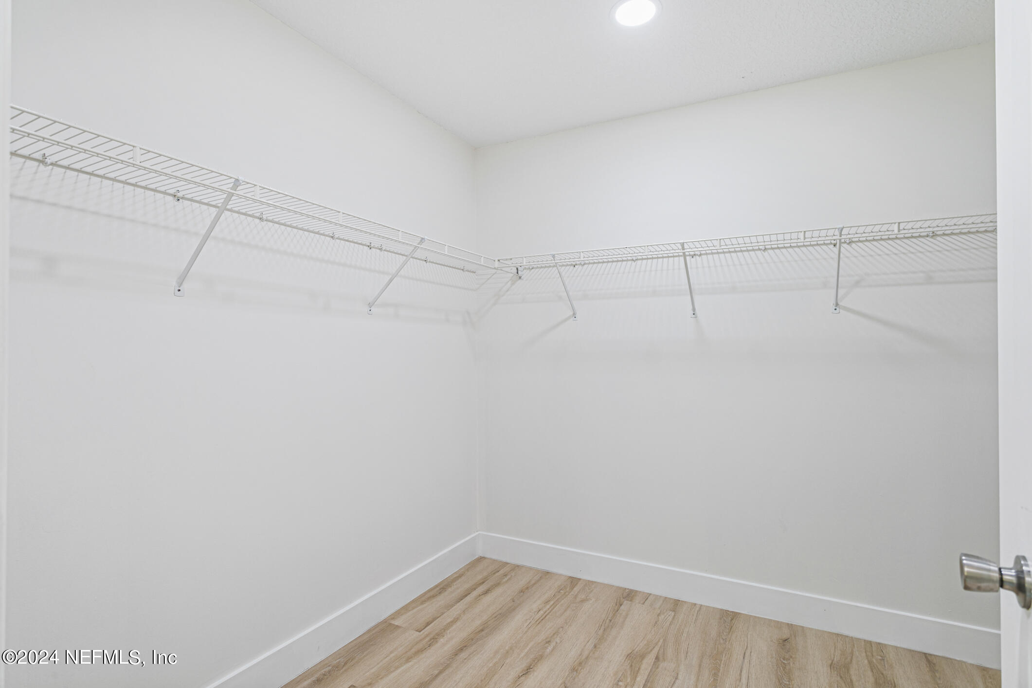 622 Cherry Street Neptune Beach, FL 32266 - Photo 31 of 77 a view of a room with racks on the wall