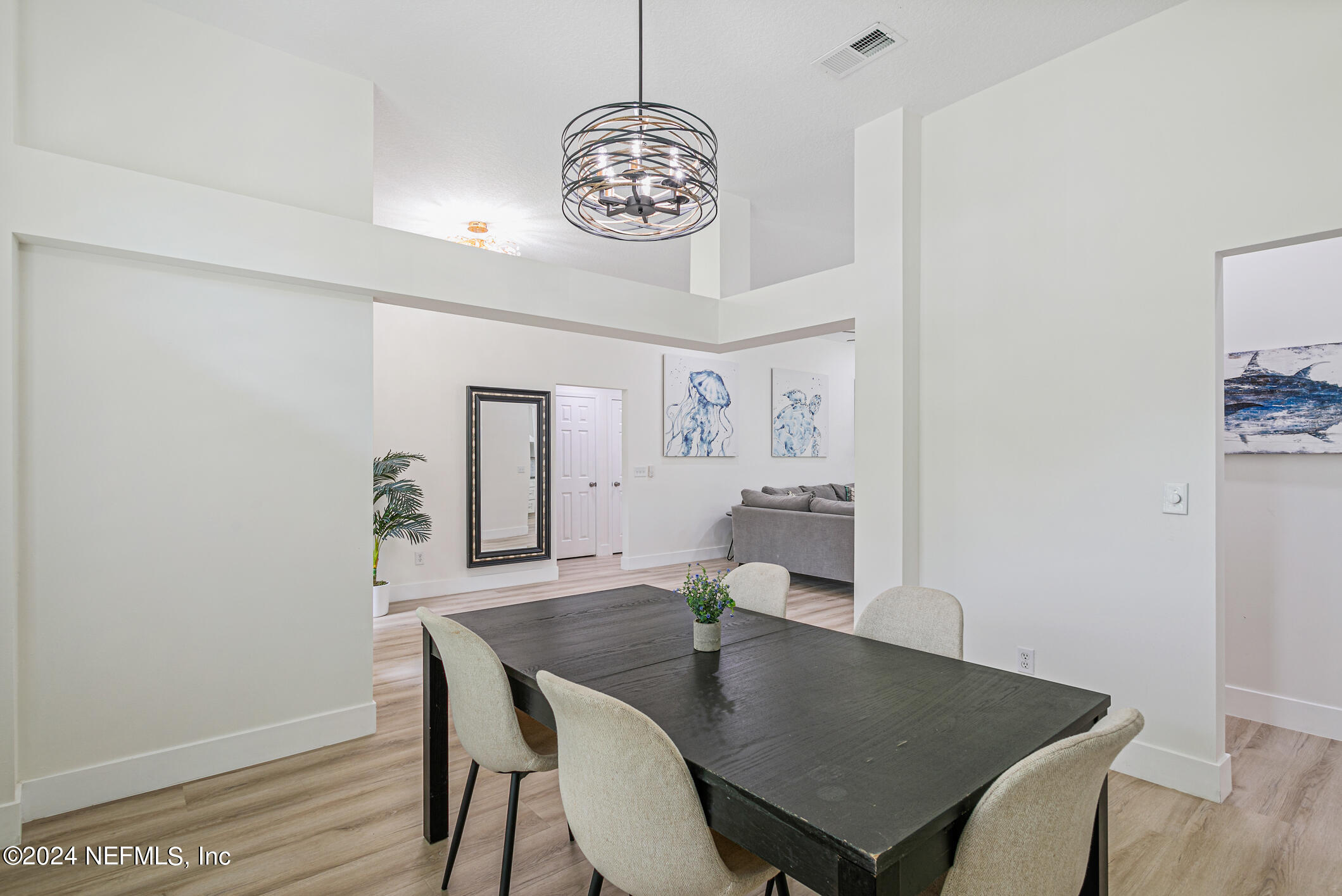 622 Cherry Street Neptune Beach, FL 32266 - Photo 32 of 77 a view of a dining room with furniture and wooden floor