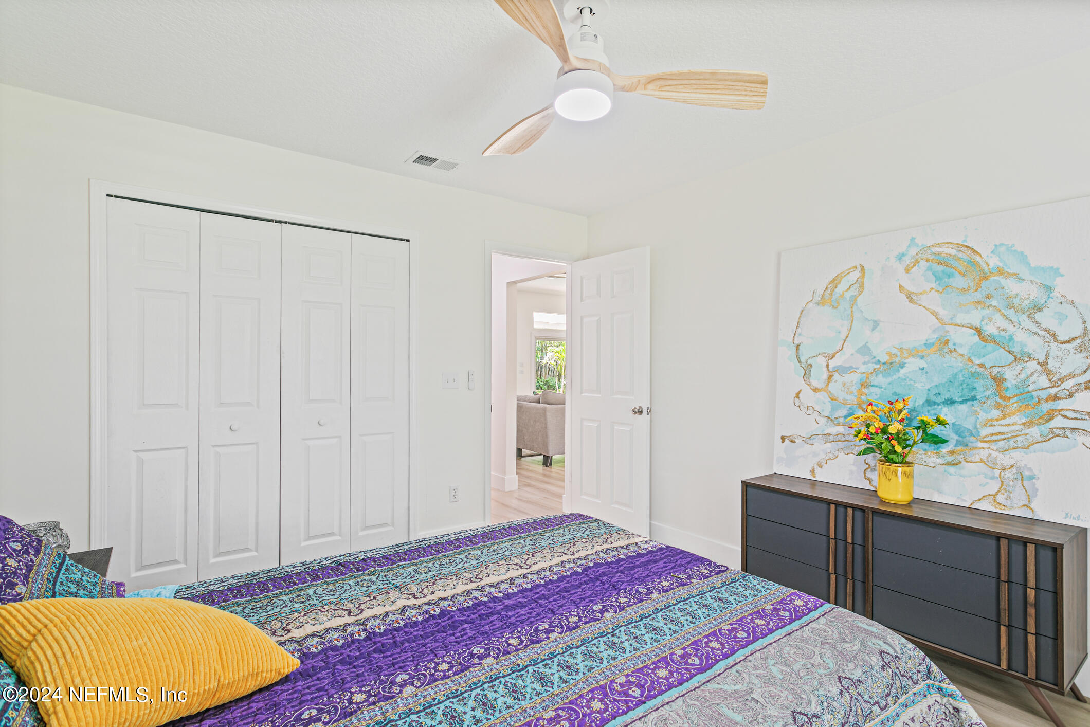 622 Cherry Street Neptune Beach, FL 32266 - Photo 36 of 77 a bedroom with a bed and a dresser in it