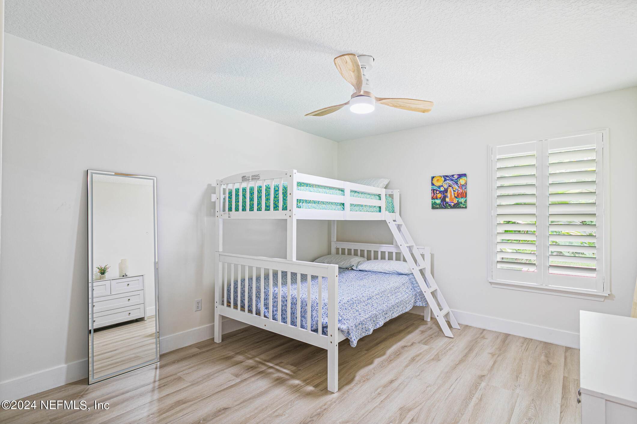 622 Cherry Street Neptune Beach, FL 32266 - Photo 40 of 77 a bedroom with a bed and a window