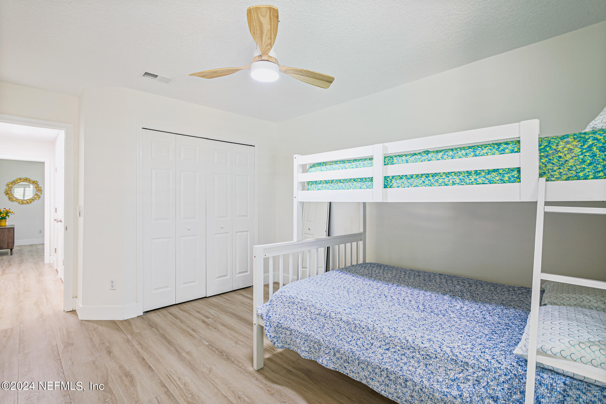 622 Cherry Street Neptune Beach, FL 32266 - Photo 42 of 77 a bedroom with a bed and a window