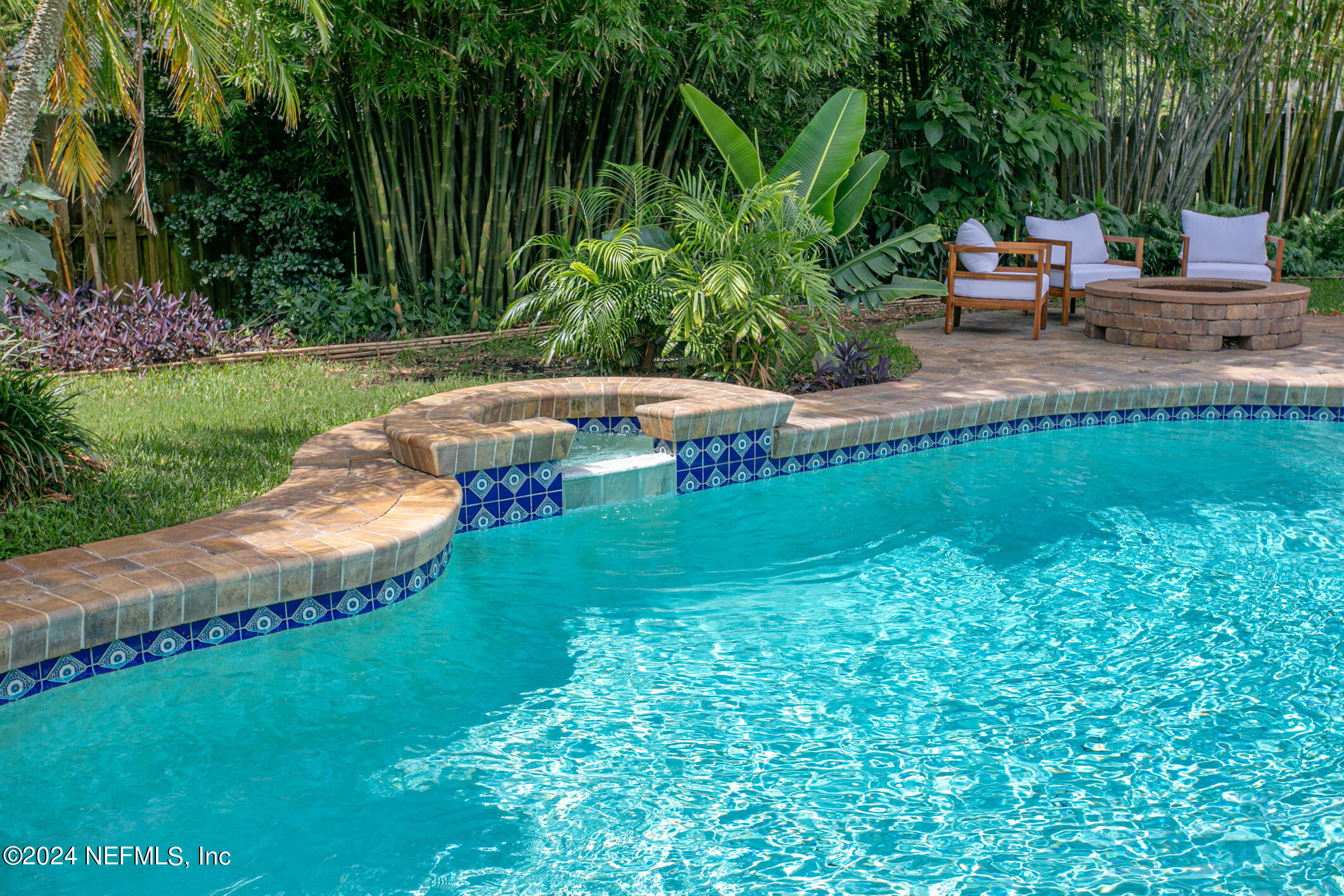 622 Cherry Street Neptune Beach, FL 32266 - Photo 45 of 77 a view of a garden with lawn chairs
