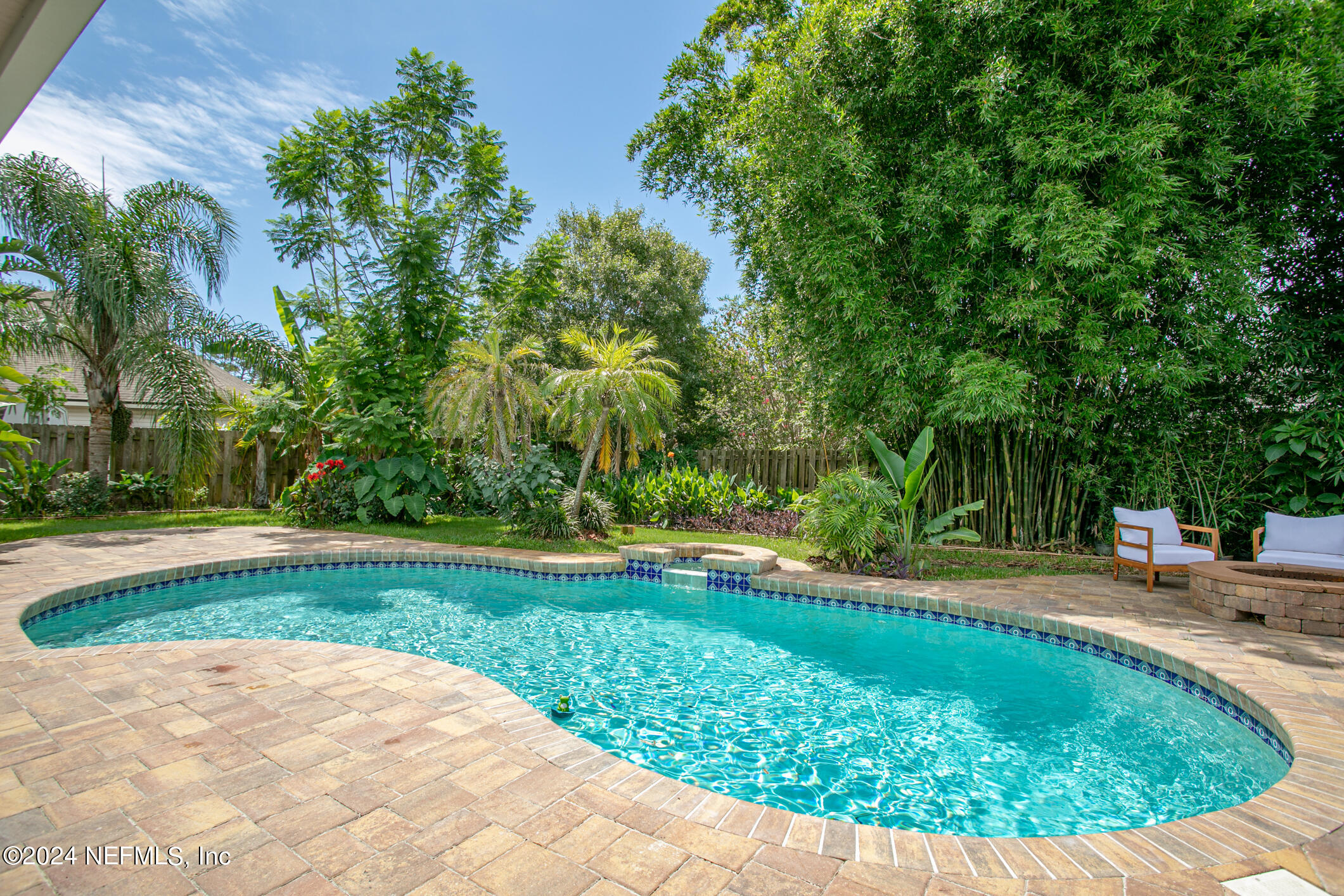 622 Cherry Street Neptune Beach, FL 32266 - Photo 47 of 77 a view of a swimming pool with a yard