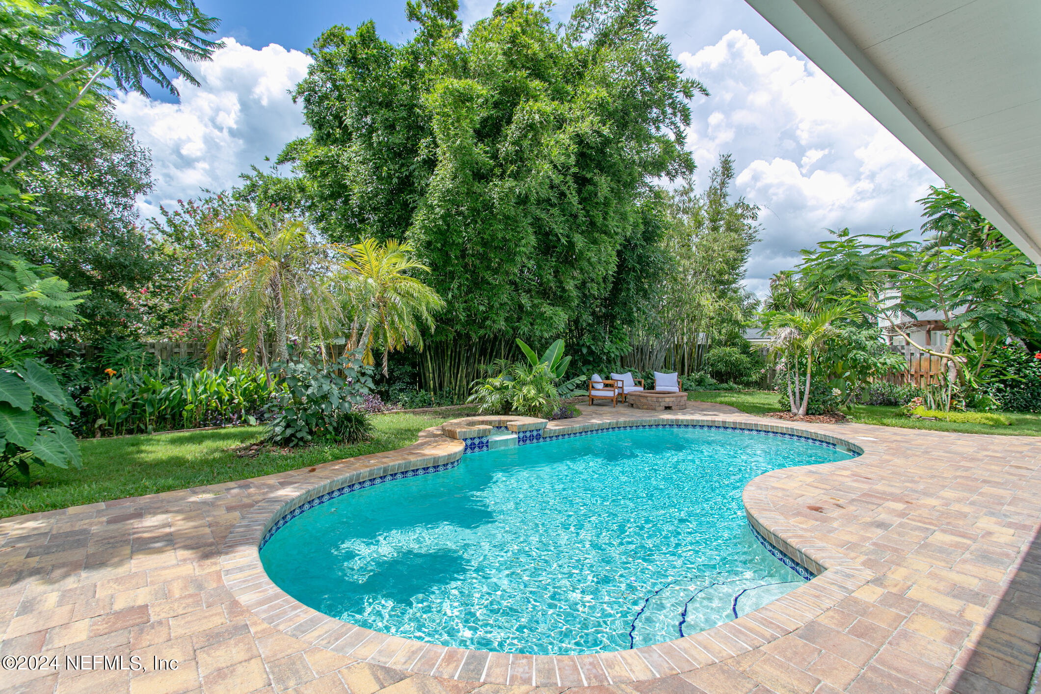 622 Cherry Street Neptune Beach, FL 32266 - Photo 50 of 77 a view of a swimming pool with a yard