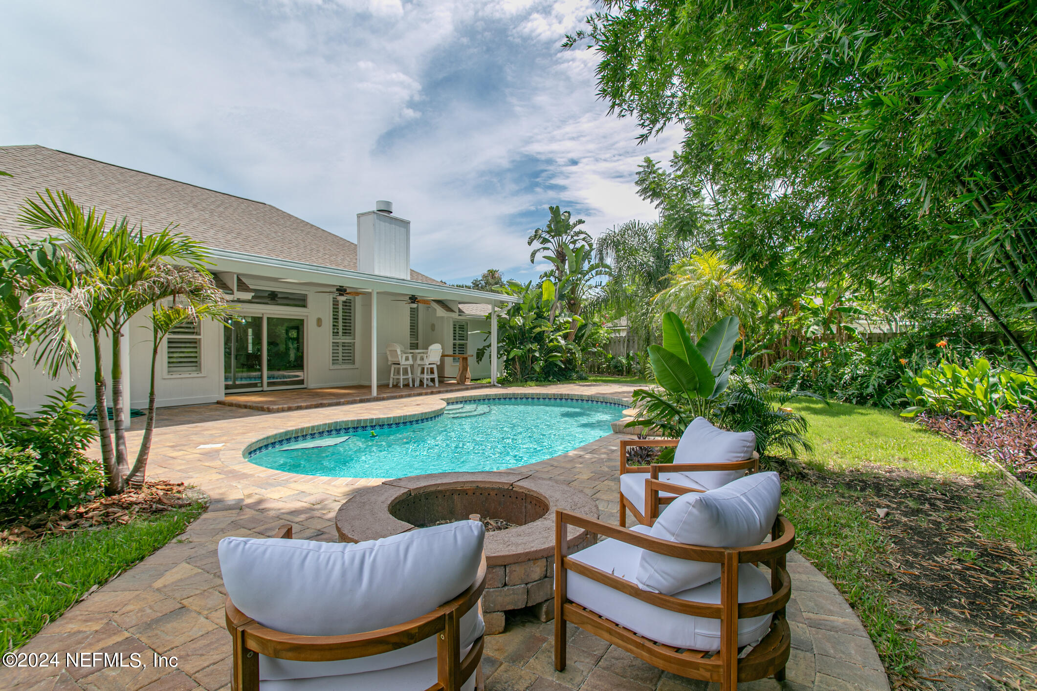 622 Cherry Street Neptune Beach, FL 32266 - Photo 52 of 77 a view of a house with backyard sitting area and garden