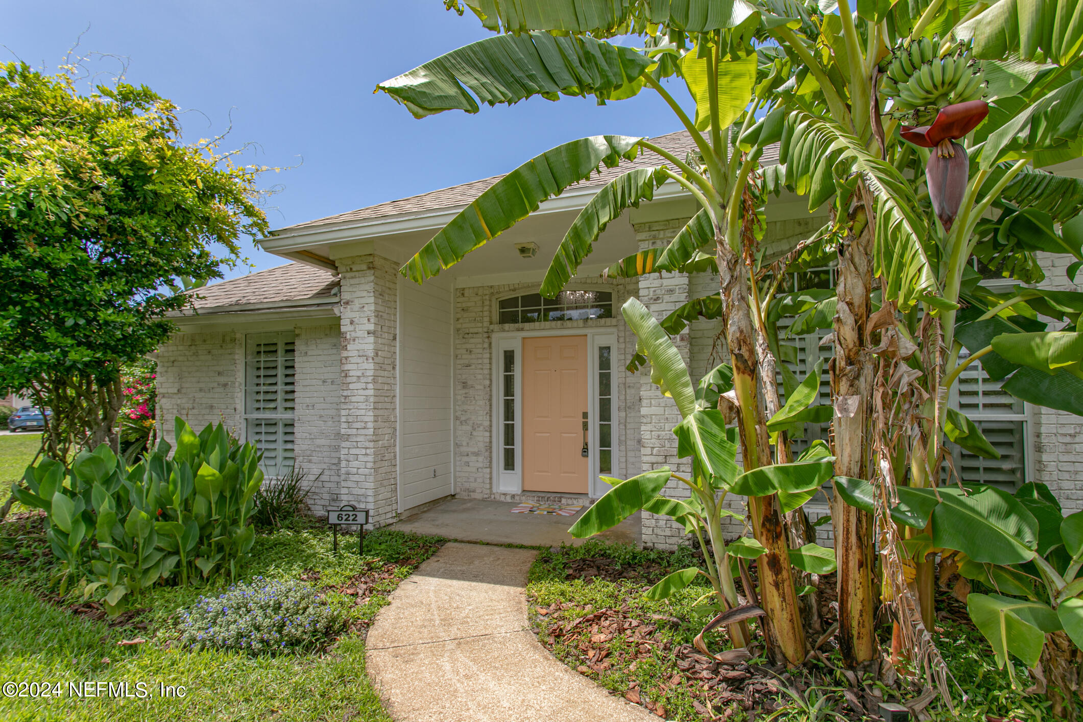 622 Cherry Street Neptune Beach, FL 32266 - Photo 59 of 77 a front view of a house with a yard