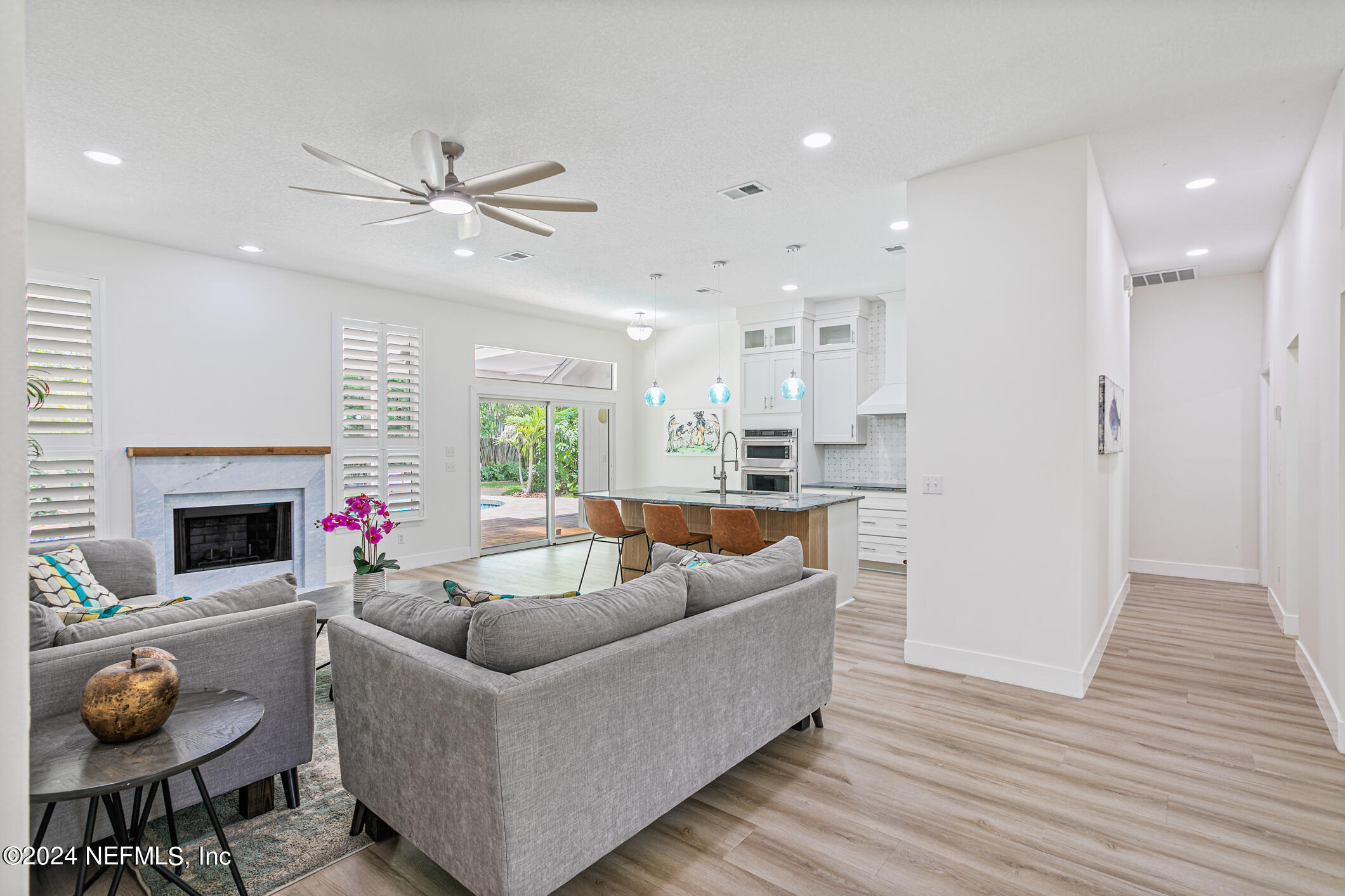 622 Cherry Street Neptune Beach, FL 32266 - Photo 6 of 77 a living room with furniture and a fireplace