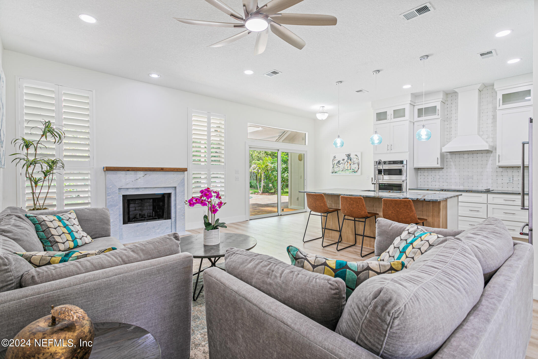 622 Cherry Street Neptune Beach, FL 32266 - Photo 7 of 77 a living room with furniture and a fireplace