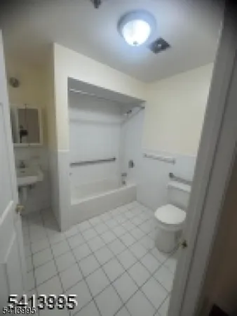 a bathroom with a sink and a toilet