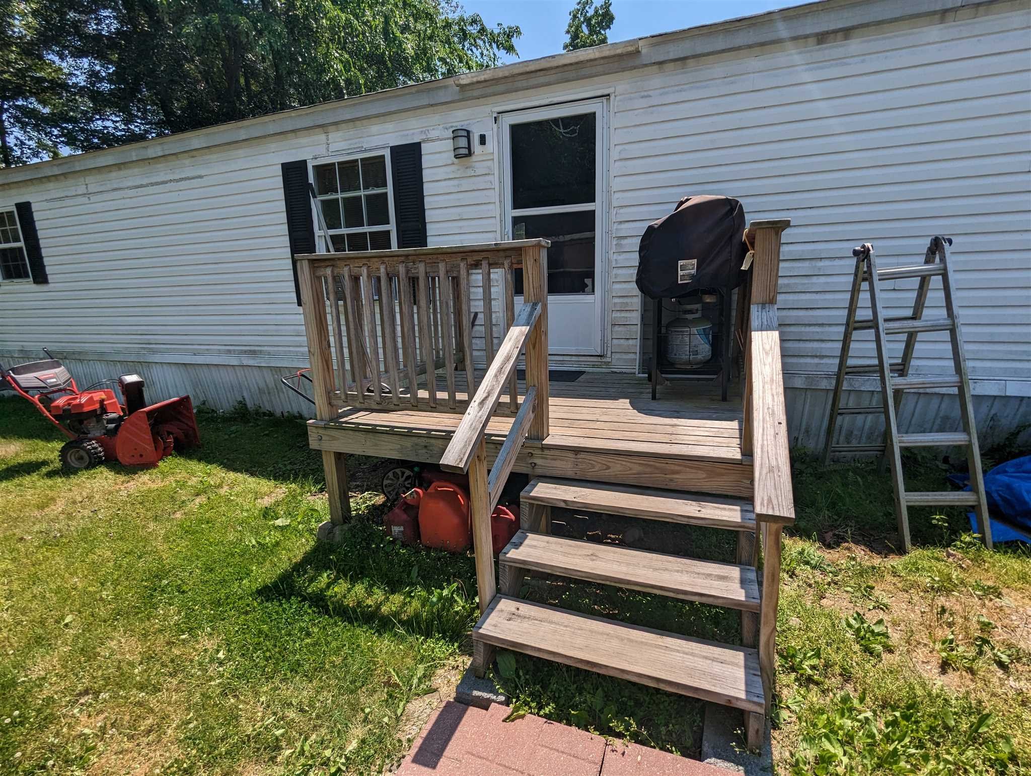 9 Depew Park Wallkill, NY 12589 - Photo 2 of 19 a view of a chairs and table in the back yard of the house
