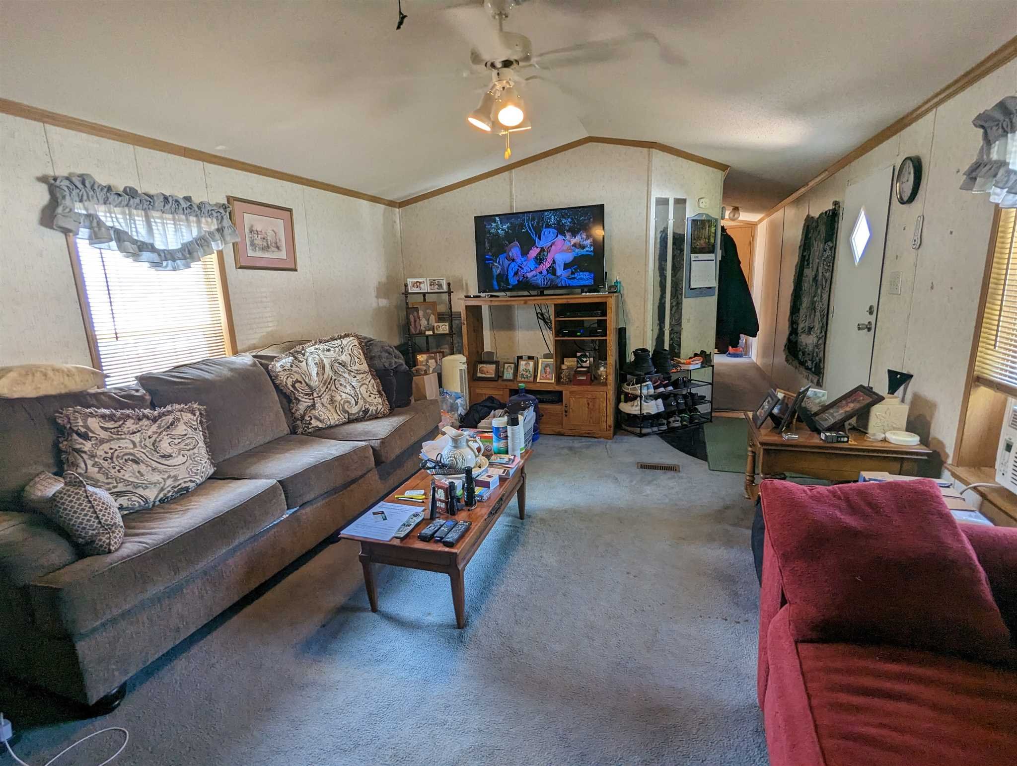 9 Depew Park Wallkill, NY 12589 - Photo 8 of 19 a living room with furniture a flat screen tv and a large window