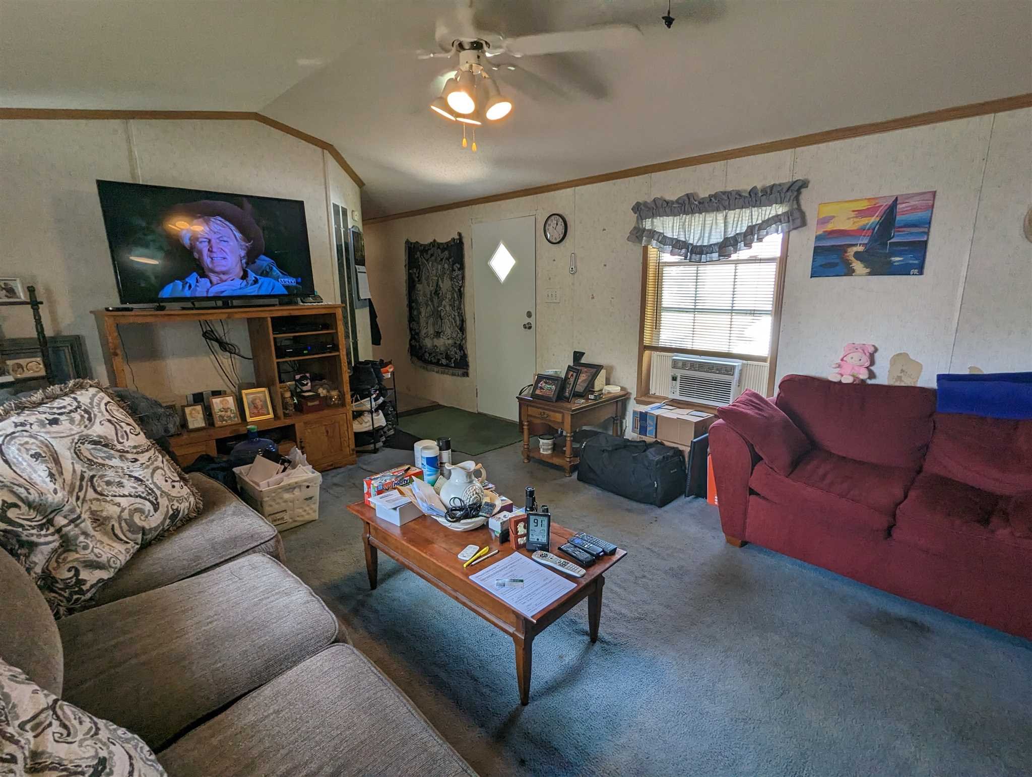 9 Depew Park Wallkill, NY 12589 - Photo 9 of 19 a living room with furniture a large window and a flat screen tv