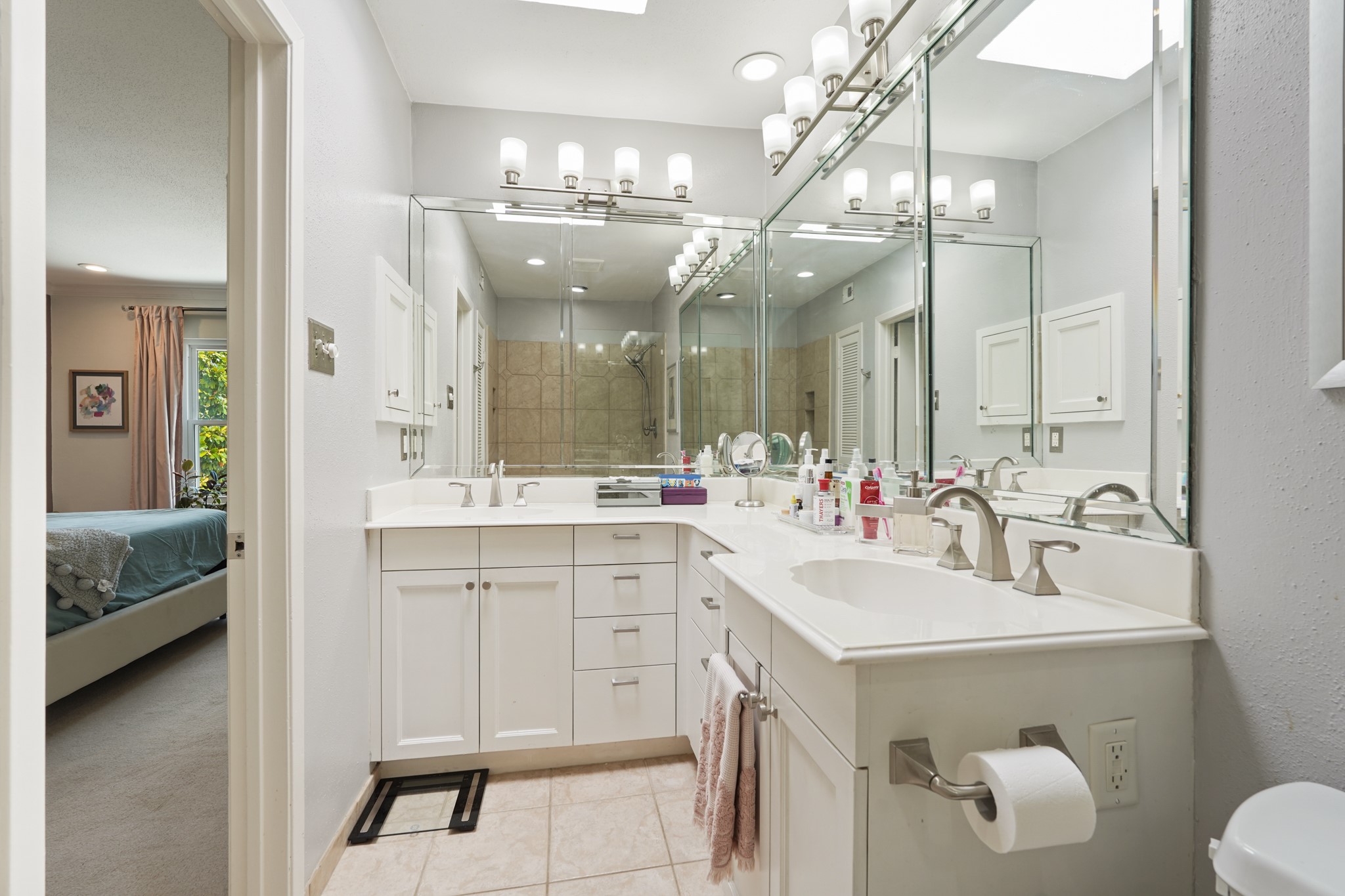 2236 South Piney Point Road, Unit 101 Houston, TX 77063 - Photo 12 of 21 Master bath with dual sinks, and large mirrors.