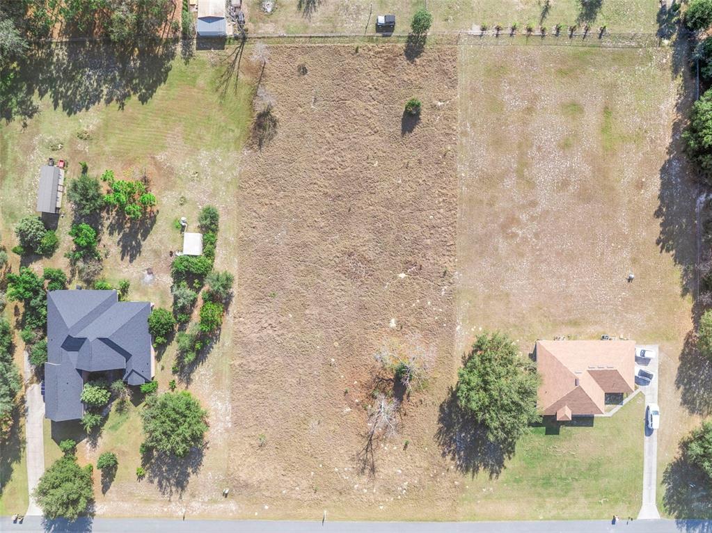 Rolling Oak Road Sorrento, FL 32776 - Photo 2 of 8 an aerial view of a house with a yard