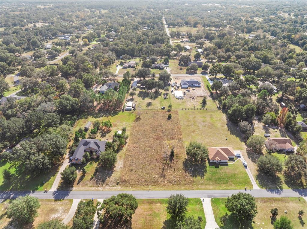 Rolling Oak Road Sorrento, FL 32776 - Photo 6 of 8 an aerial view of residential houses with outdoor space