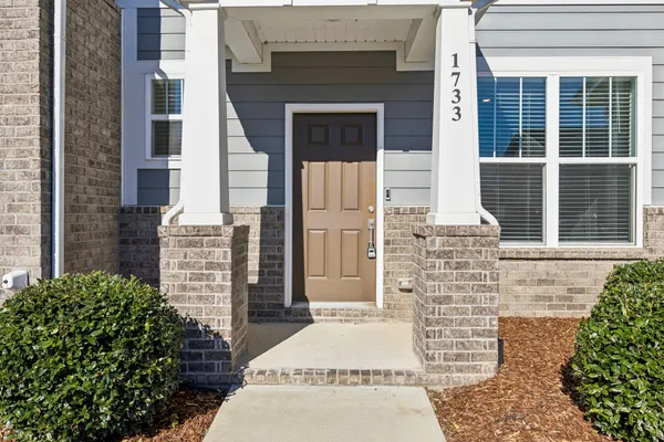a front view of a house with garage