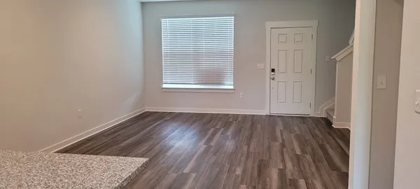 a kitchen with a refrigerator and a sink